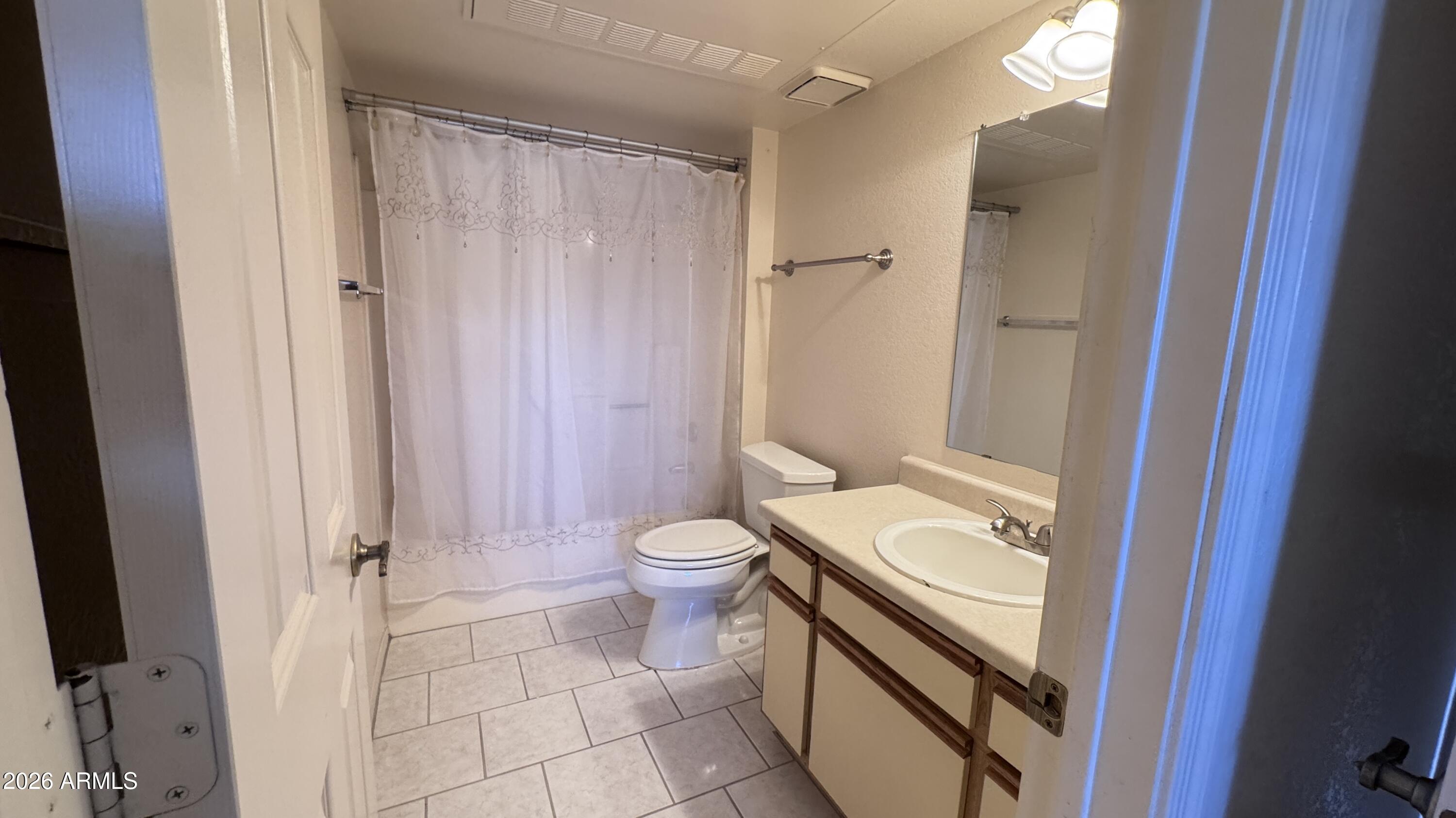 1440 North Idaho Road, Unit 1016 Apache Junction, AZ 85119 - Photo 14 of 22 a bathroom with a sink a toilet and a shower