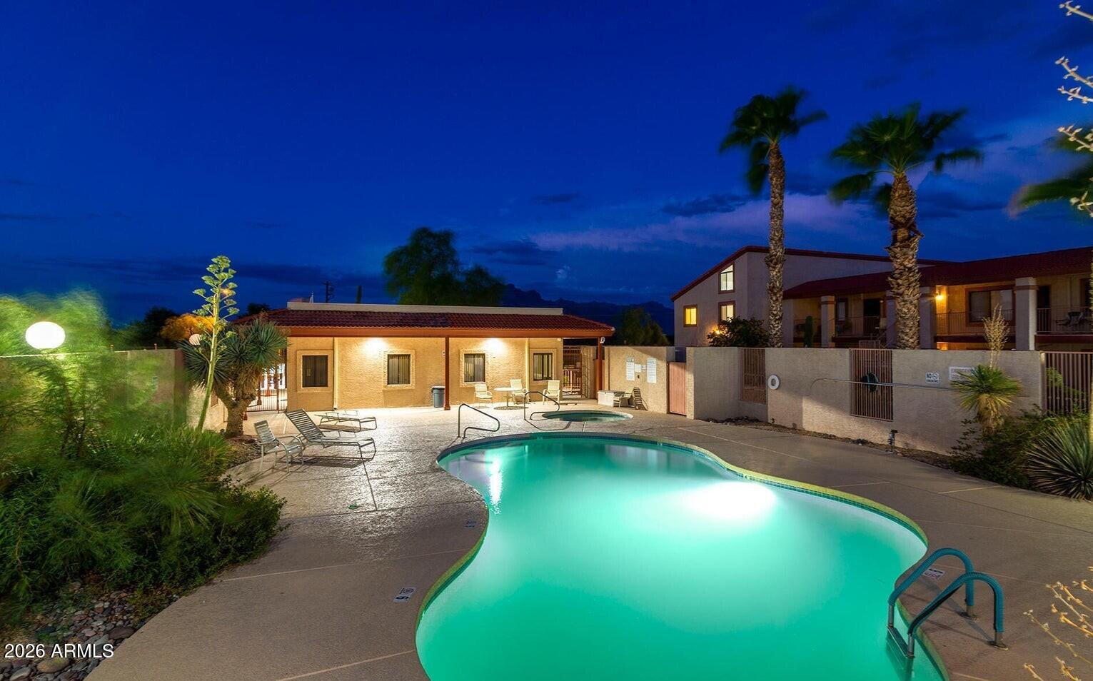 1440 North Idaho Road, Unit 1016 Apache Junction, AZ 85119 - Photo 19 of 22 a view of a swimming pool with an outdoor space