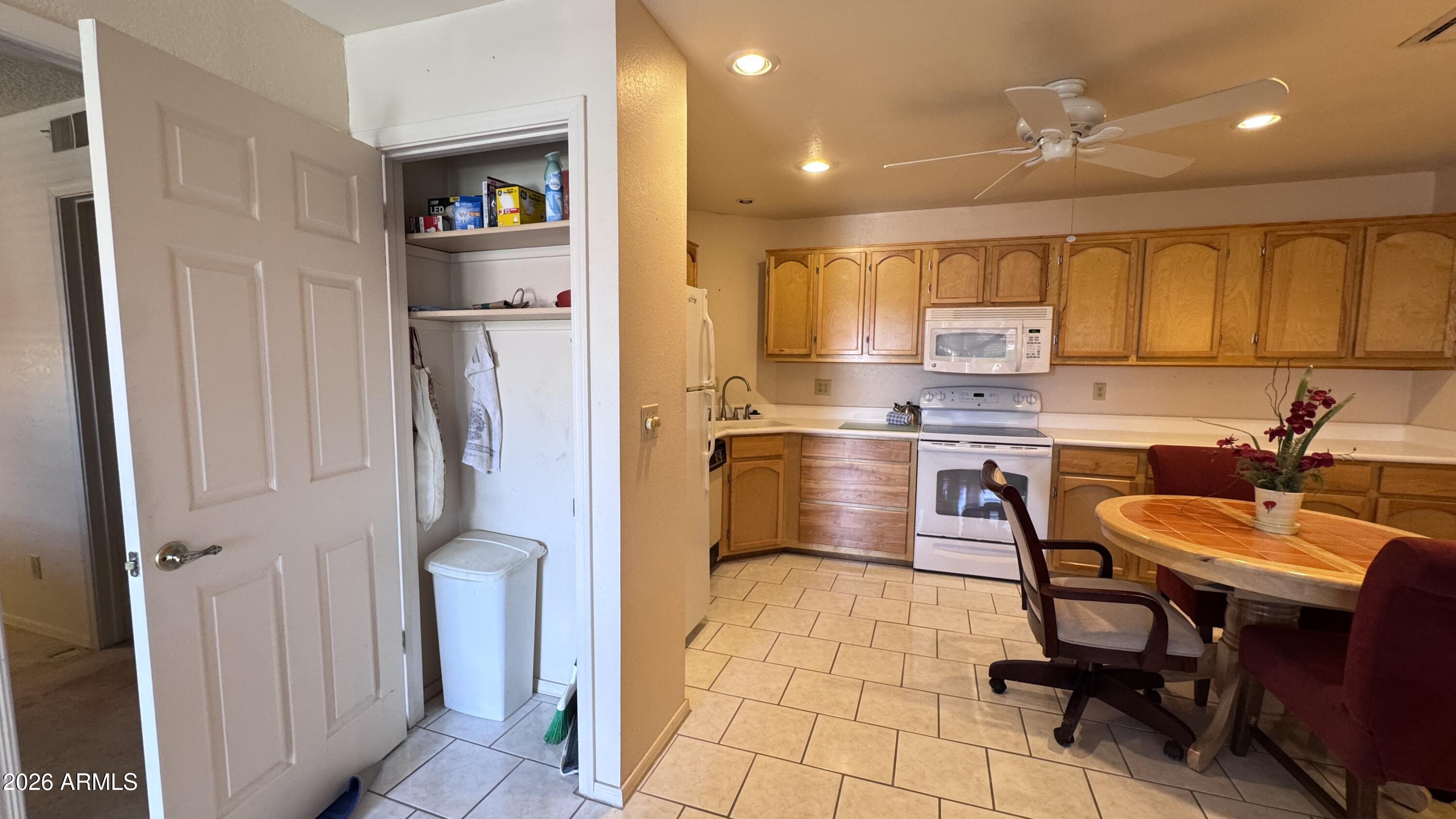 1440 North Idaho Road, Unit 1016 Apache Junction, AZ 85119 - Photo 6 of 22 a kitchen with a sink cabinets and refrigerator