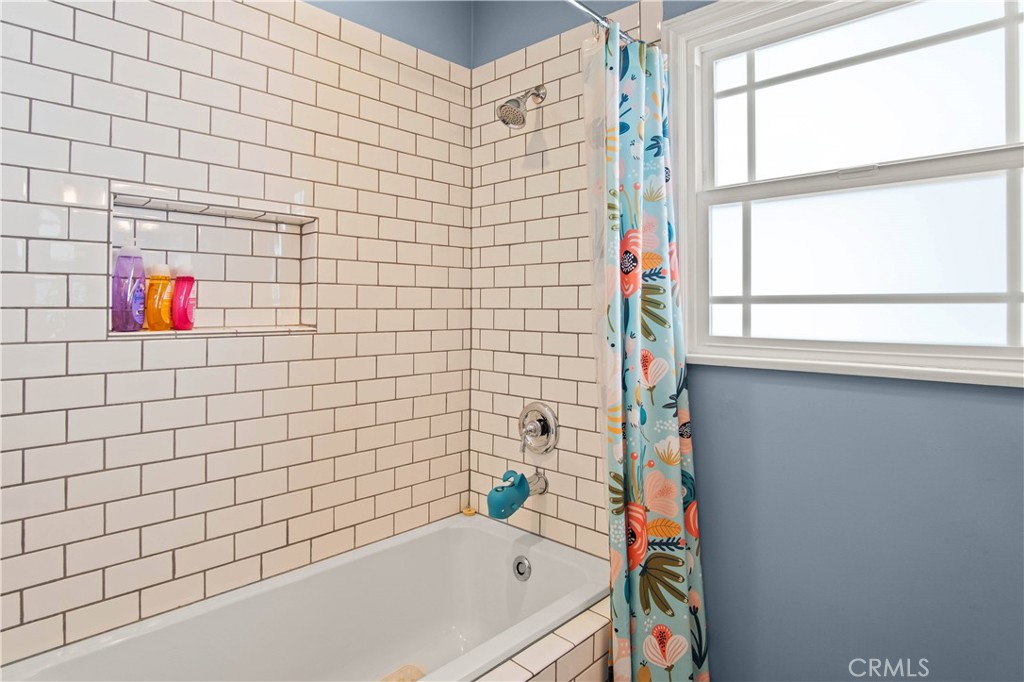 6835 Aldea Avenue Van Nuys, CA 91406 - Photo 13 of 50 a bathroom with a bathtub and a shower
