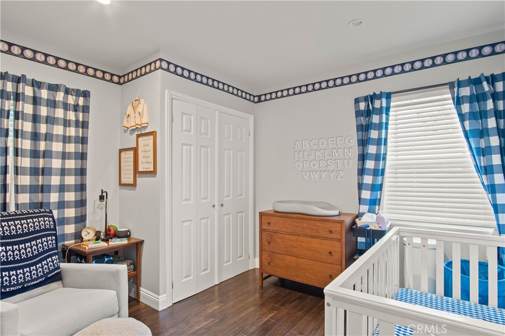 6835 Aldea Avenue Van Nuys, CA 91406 - Photo 14 of 50 a view of a bedroom with furniture and wooden floor