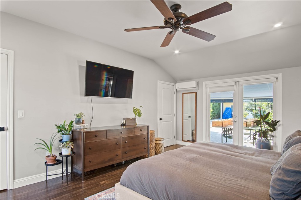 6835 Aldea Avenue Van Nuys, CA 91406 - Photo 17 of 50 a bedroom with a bed and a potted plant