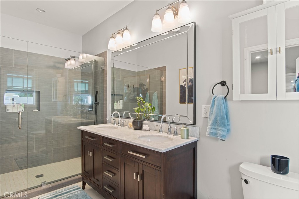 6835 Aldea Avenue Van Nuys, CA 91406 - Photo 19 of 50 a bathroom with a sink double vanity and a mirror