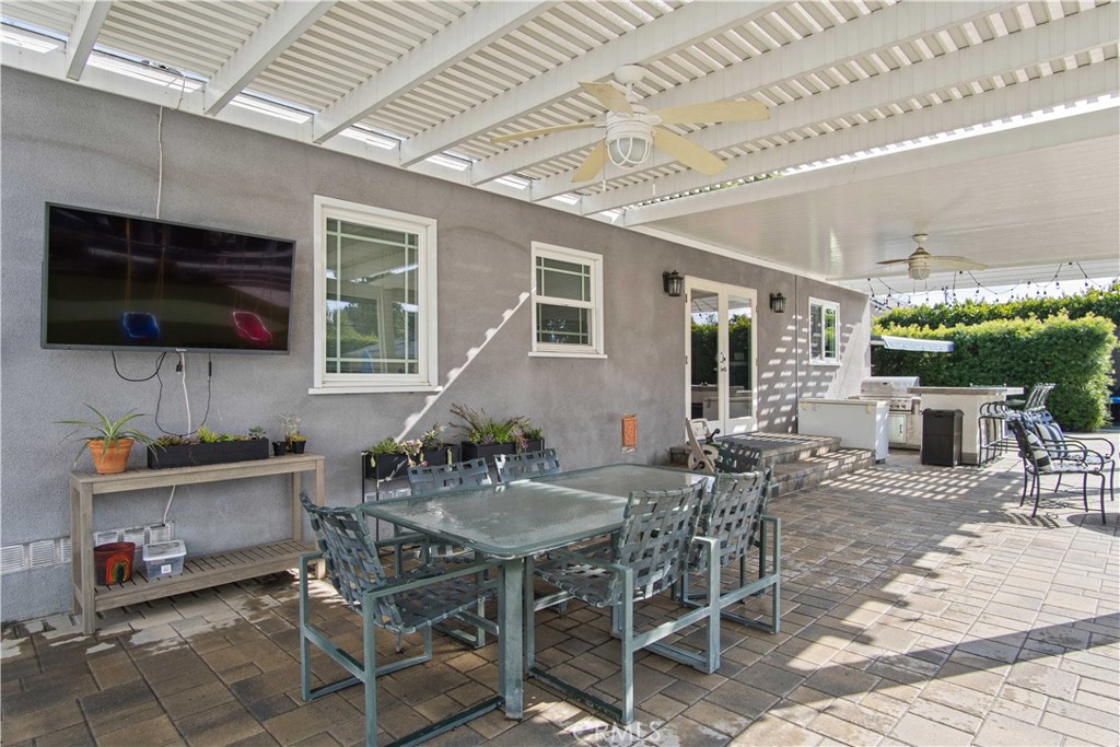 6835 Aldea Avenue Van Nuys, CA 91406 - Photo 20 of 50 a view of a dinning table and chairs in the patio