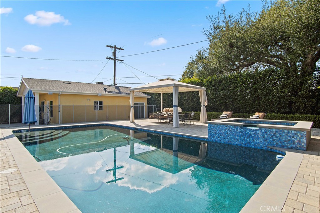 6835 Aldea Avenue Van Nuys, CA 91406 - Photo 30 of 50 a view of a swimming pool with a patio