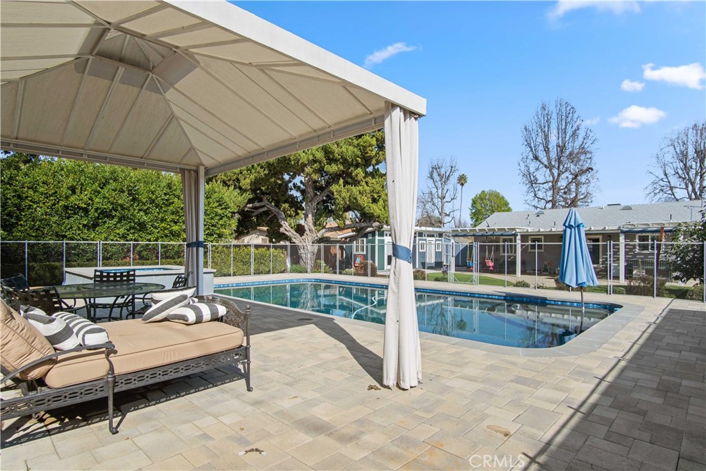 6835 Aldea Avenue Van Nuys, CA 91406 - Photo 31 of 50 a view of a patio with couches chairs and potted plants