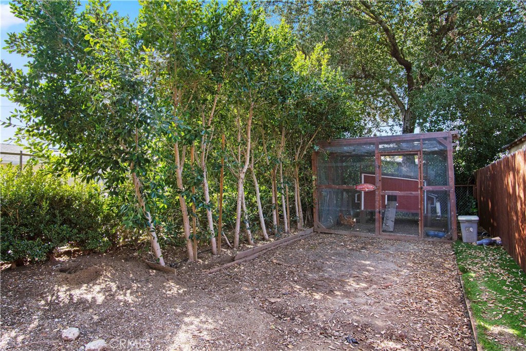 6835 Aldea Avenue Van Nuys, CA 91406 - Photo 32 of 50 a view of a backyard with a trees