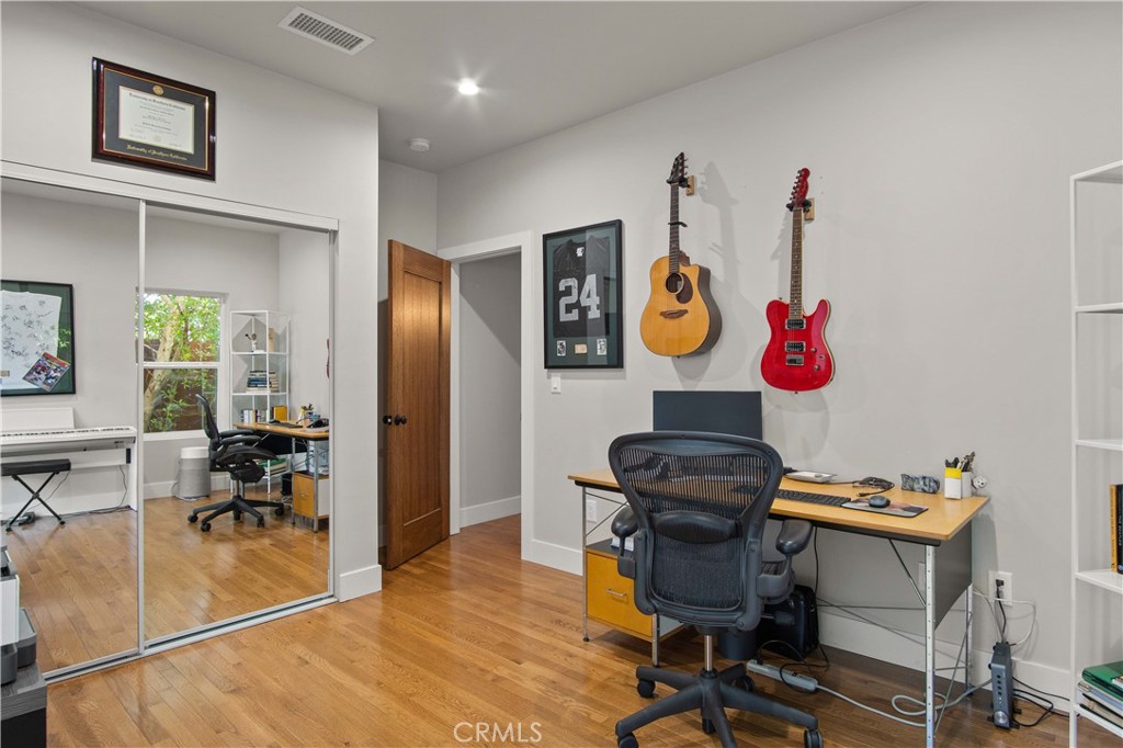 6835 Aldea Avenue Van Nuys, CA 91406 - Photo 43 of 50 a view of a dining room with furniture and chandelier