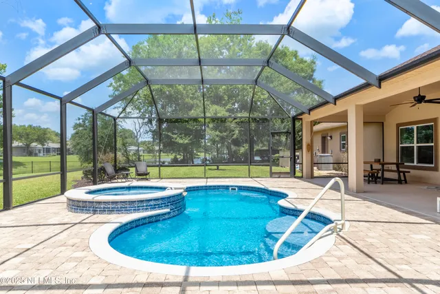 a view of a house with backyard porch and sitting area