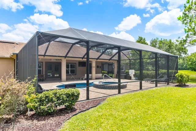 a kitchen with stainless steel appliances granite countertop a kitchen island a stove and a sink