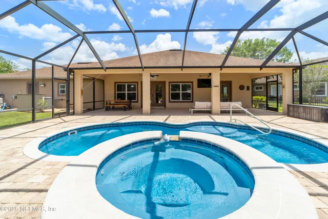 a swimming pool with outdoor seating yard and outdoor seating