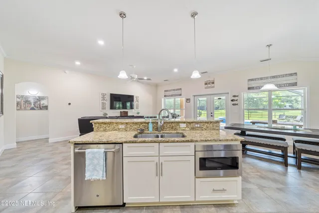 a bedroom with a bed and a television