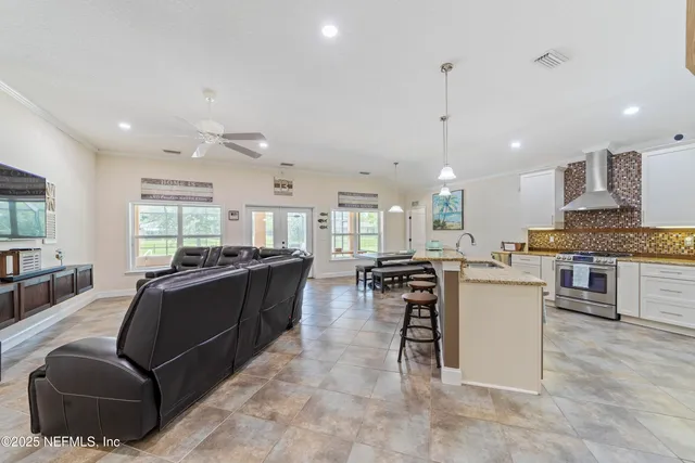 a spacious bathroom with a granite countertop sink and a mirror