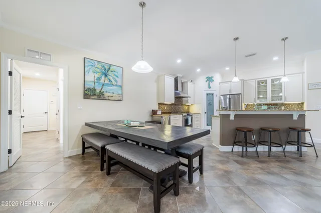 a bathroom with a granite countertop sink a mirror and a shower