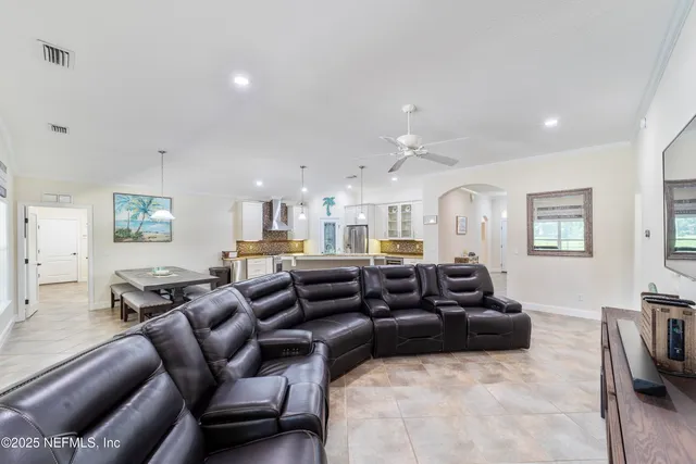 a large white bed in a white room