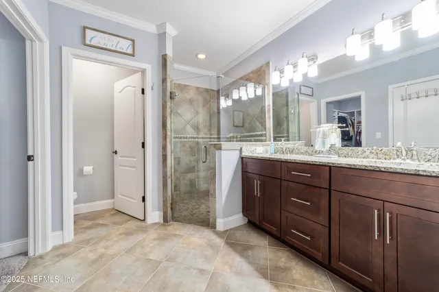 a view of a house with a big yard and potted plants