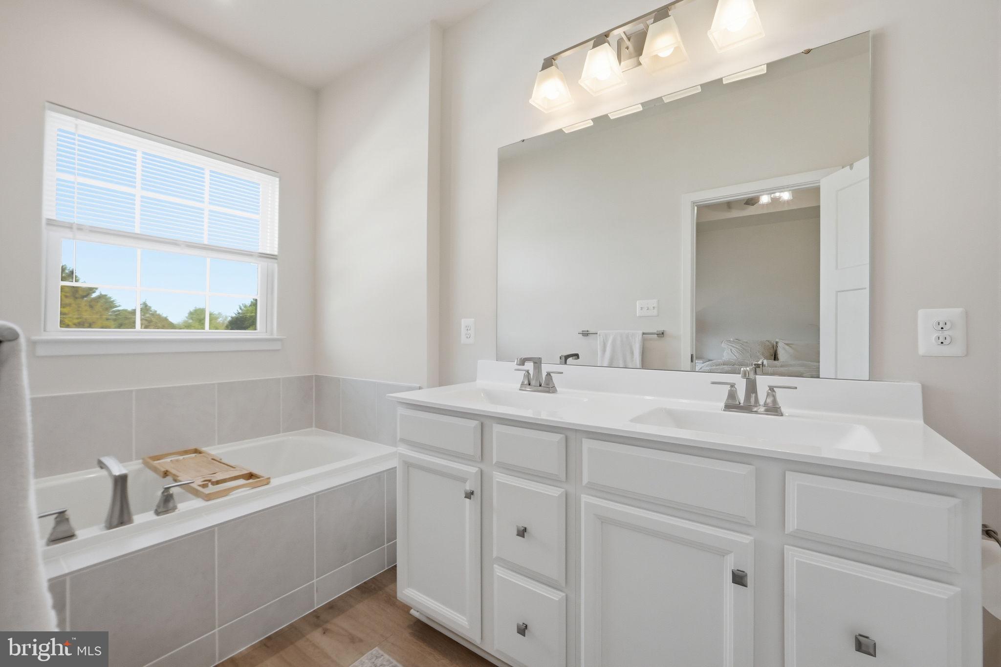 223 Edwin Road Frederick, MD 21702 - Photo 19 of 33 a bathroom with a double vanity sink mirror and