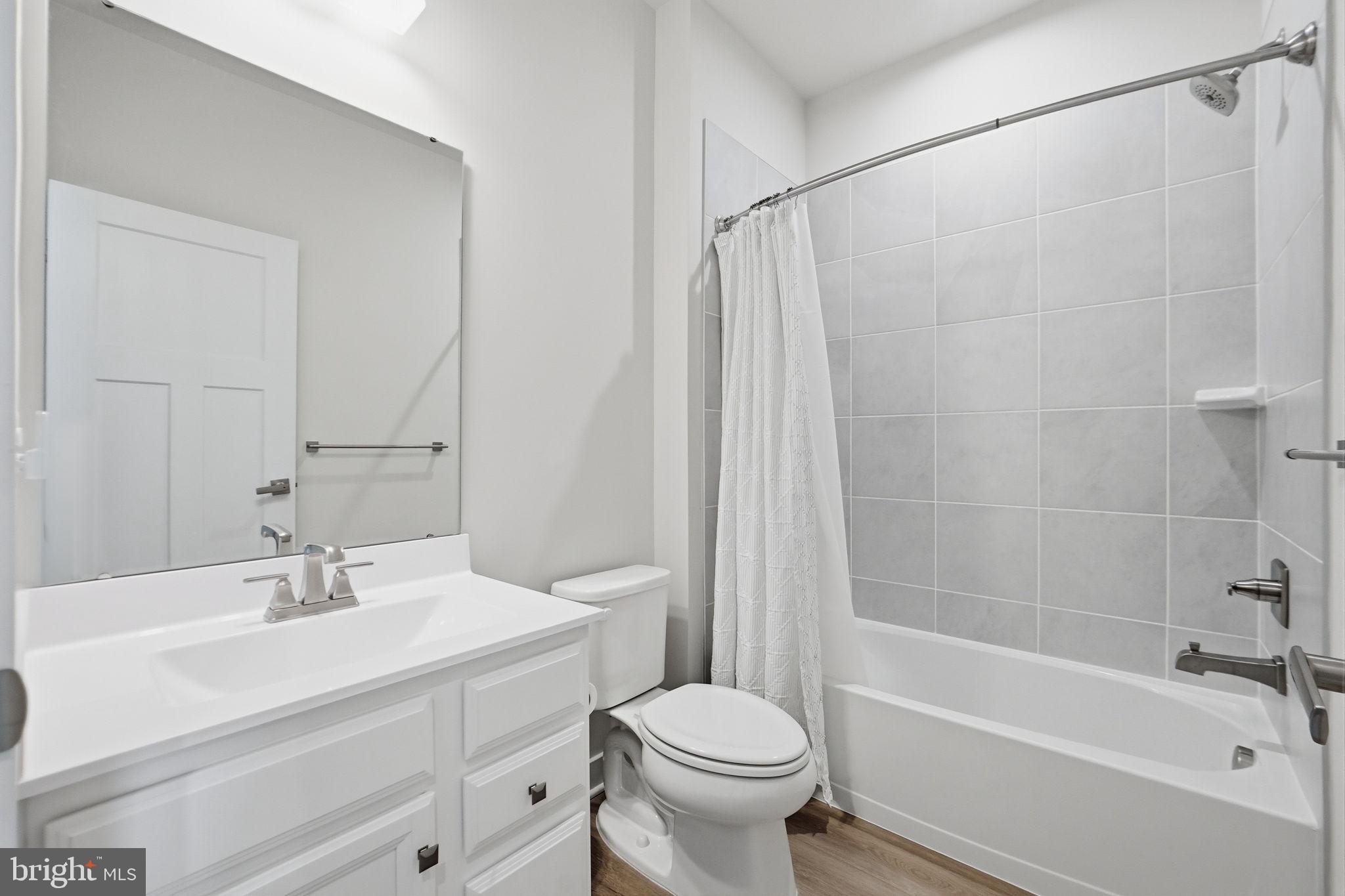 223 Edwin Road Frederick, MD 21702 - Photo 25 of 33 a bathroom with a sink toilet and bathtub