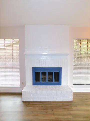 a living room with a bed furniture and a window