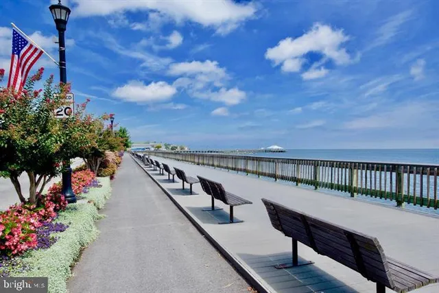 a view of a balcony with wooden fence