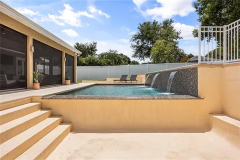 a view of swimming pool with patio