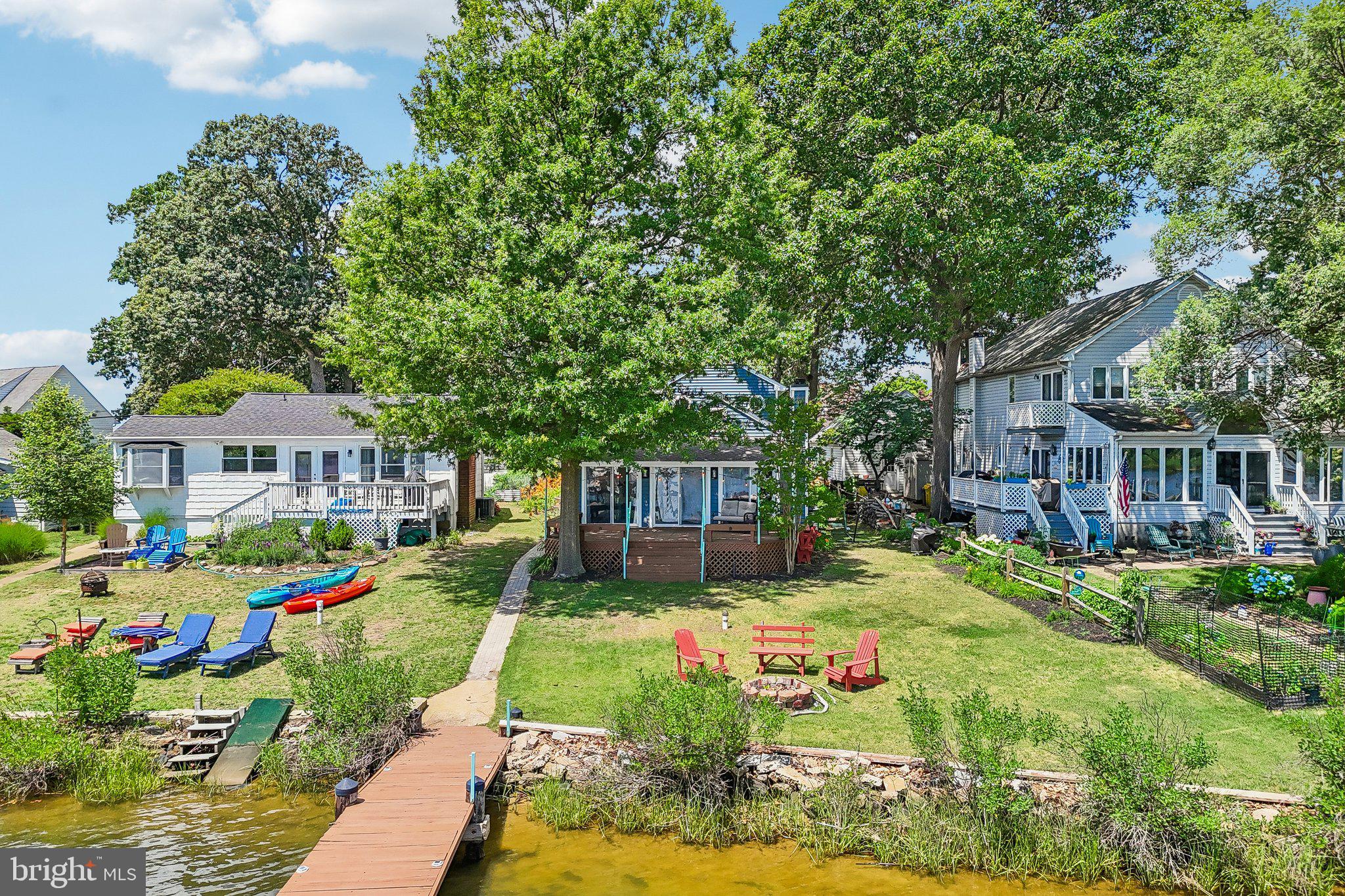 275 Gibson Road Pasadena, MD 21122 - Photo 45 of 59 Lakeside retreat with vibrant gardens.