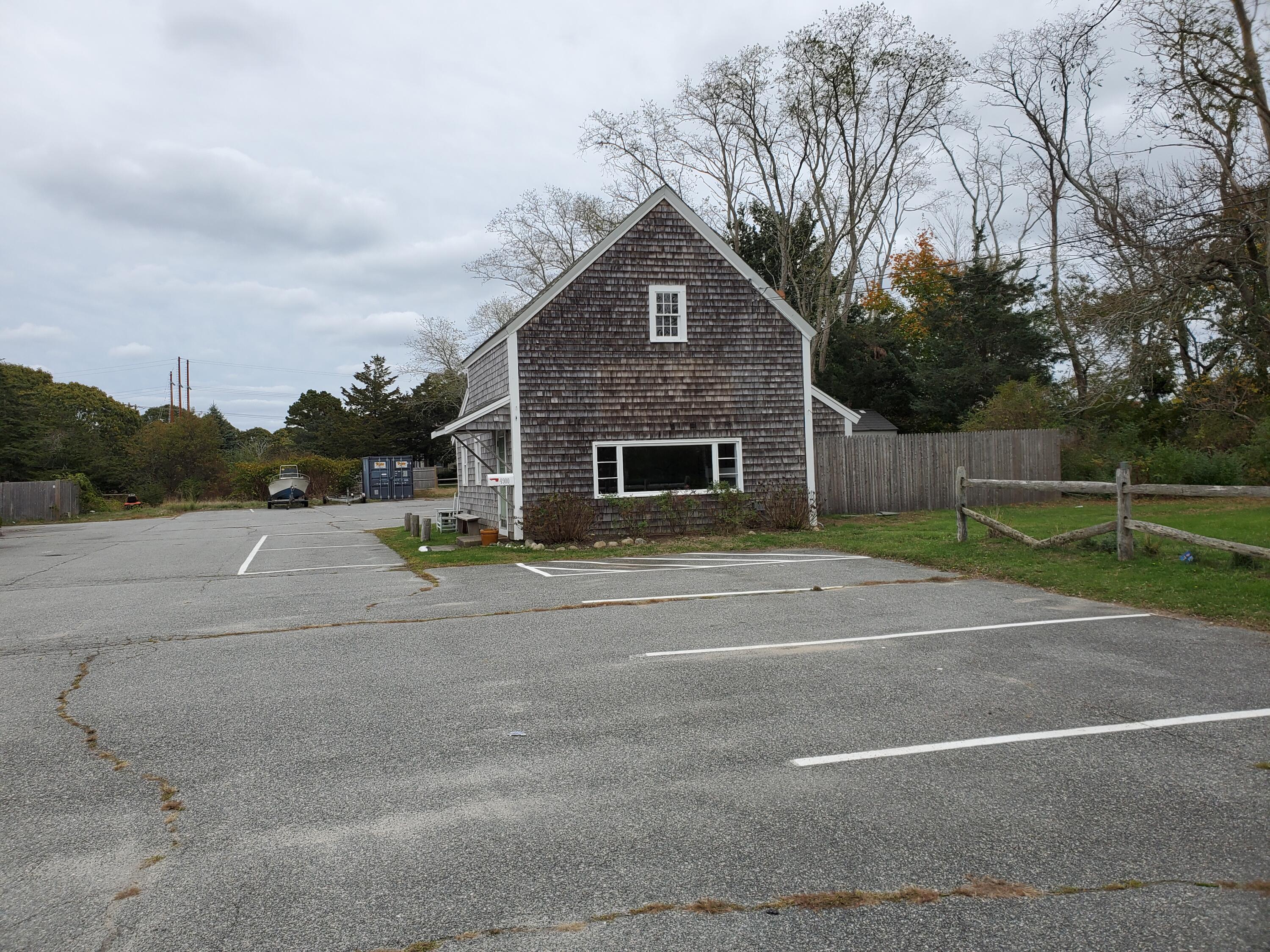 4900 State Highway Eastham, MA 02642 - Photo 1 of 16 a view of a house with a yard