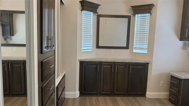 a bathroom with a sink a mirror and vanity