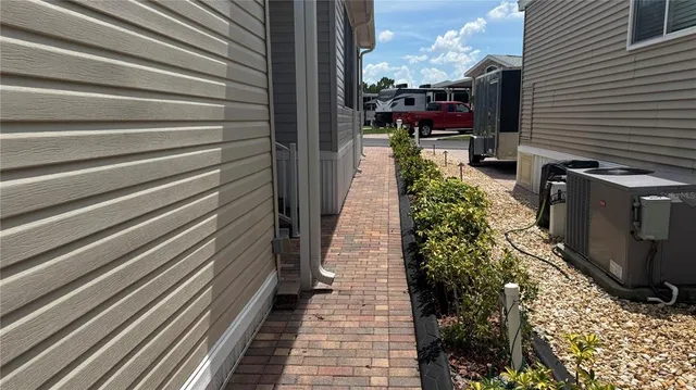 a view of houses with outdoor space and parking