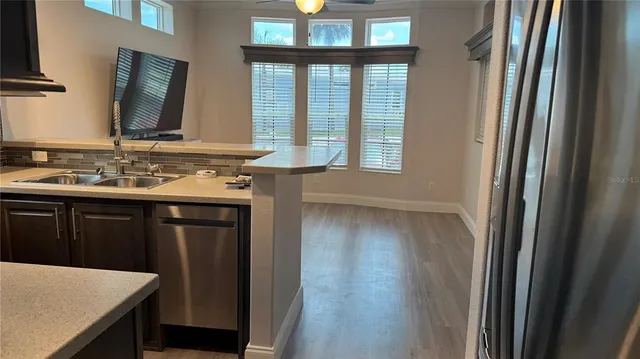 a bathroom with a sink a mirror and a window