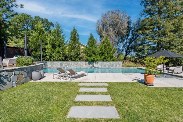 a view of a swimming pool with a patio