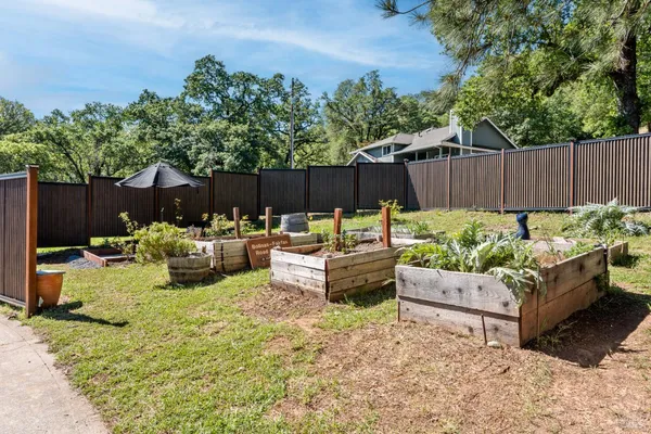 a view of a backyard with furniture and a small yard