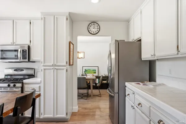 a view of kitchen with furniture and wooden floor