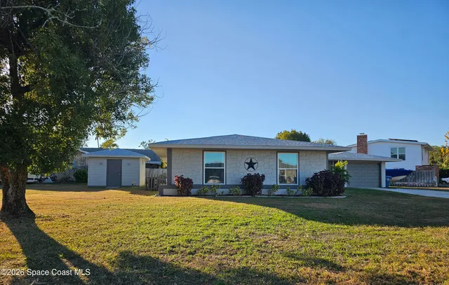 a view of house with swimming pool outdoor seating