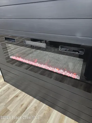 a large kitchen with stainless steel appliances kitchen island a stove a refrigerator a kitchen island a couches and a refrigerator