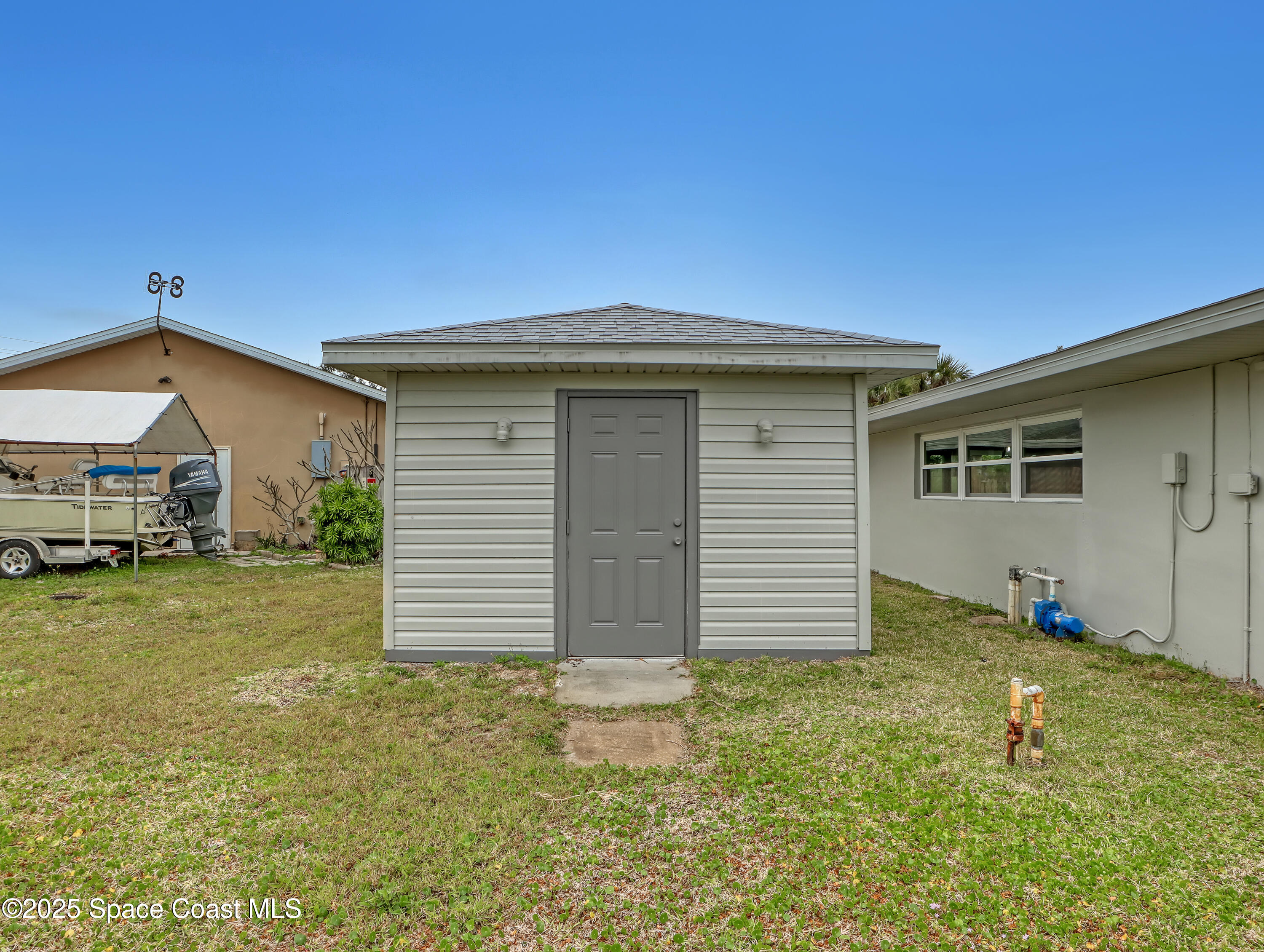 872 Sadnet Circle Northeast Palm Bay, FL 32905 - Photo 20 of 21 a front view of house with yard