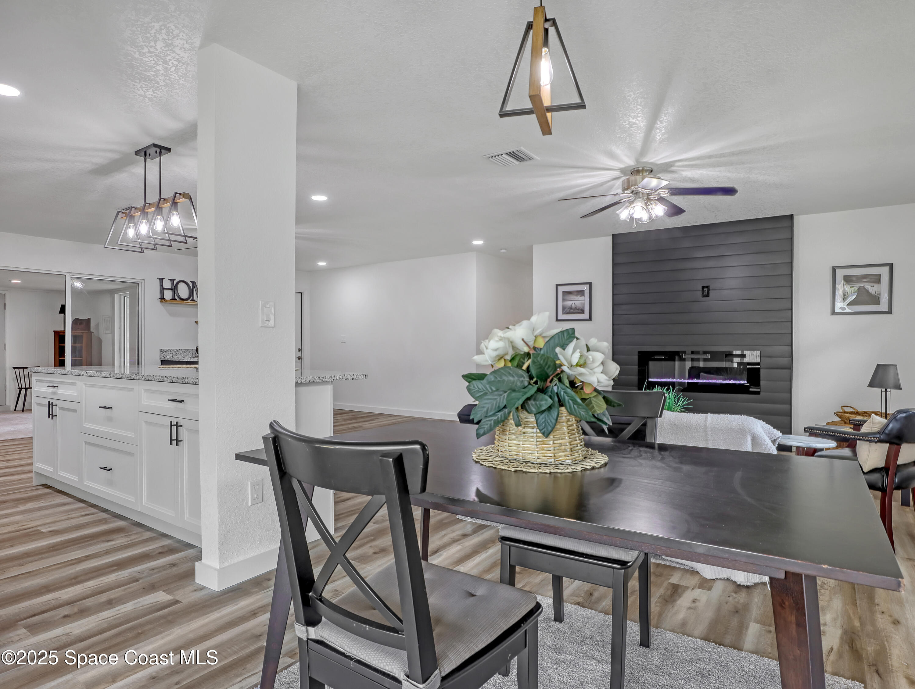 872 Sadnet Circle Northeast Palm Bay, FL 32905 - Photo 5 of 21 a view of a dining room with furniture