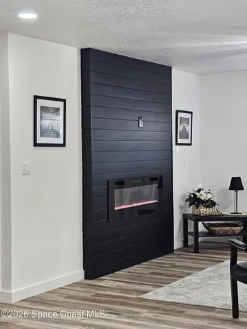 a kitchen with stainless steel appliances granite countertop a sink a stove a microwave and cabinets