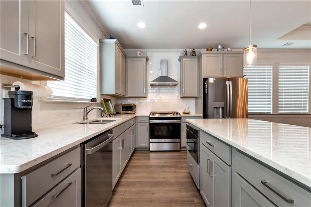 269 Grand Circle Jasper, GA 30143 - Photo 15 of 54 a large kitchen with stainless steel appliances granite countertop a sink a stove and a refrigerator