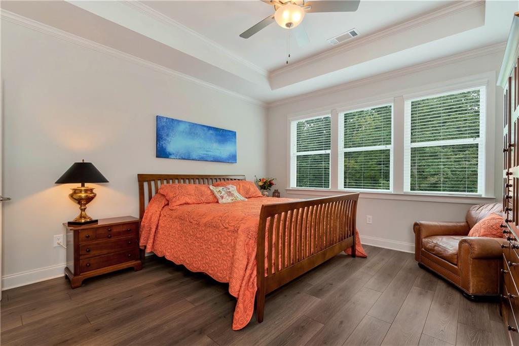 269 Grand Circle Jasper, GA 30143 - Photo 18 of 54 a bed sitting in a bedroom next to a window