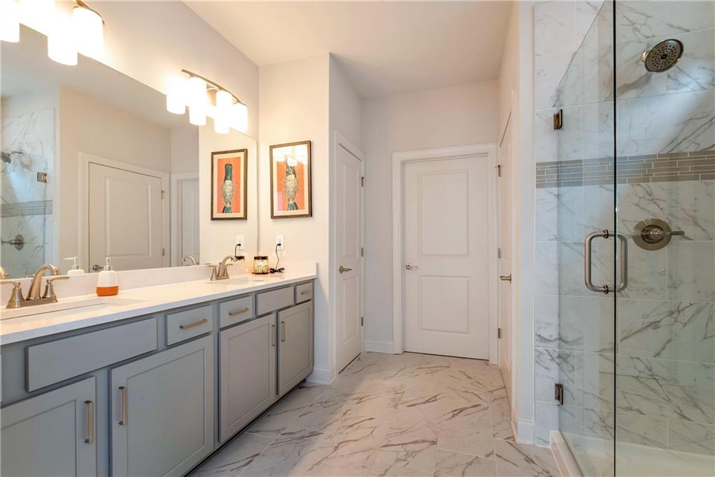 269 Grand Circle Jasper, GA 30143 - Photo 20 of 54 a spacious bathroom with a double vanity sink mirror and double