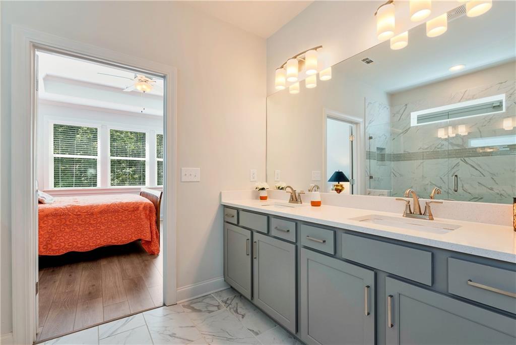 269 Grand Circle Jasper, GA 30143 - Photo 23 of 54 a en suite bathroom with 2 sink and a mirror
