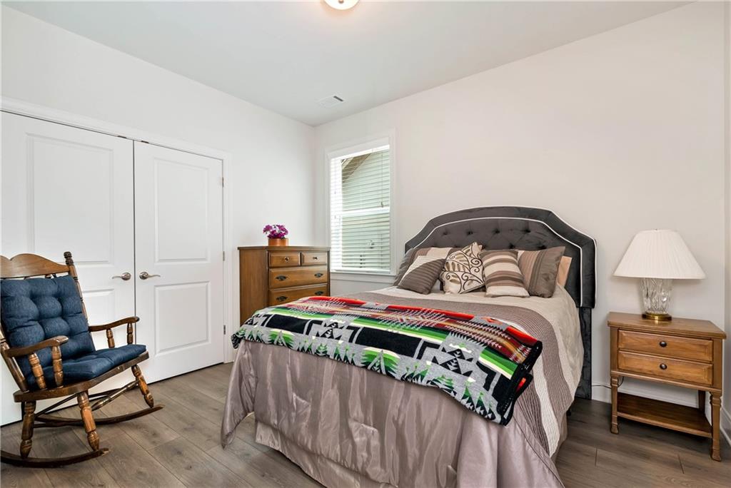 269 Grand Circle Jasper, GA 30143 - Photo 24 of 54 a bedroom with a bed and a chair