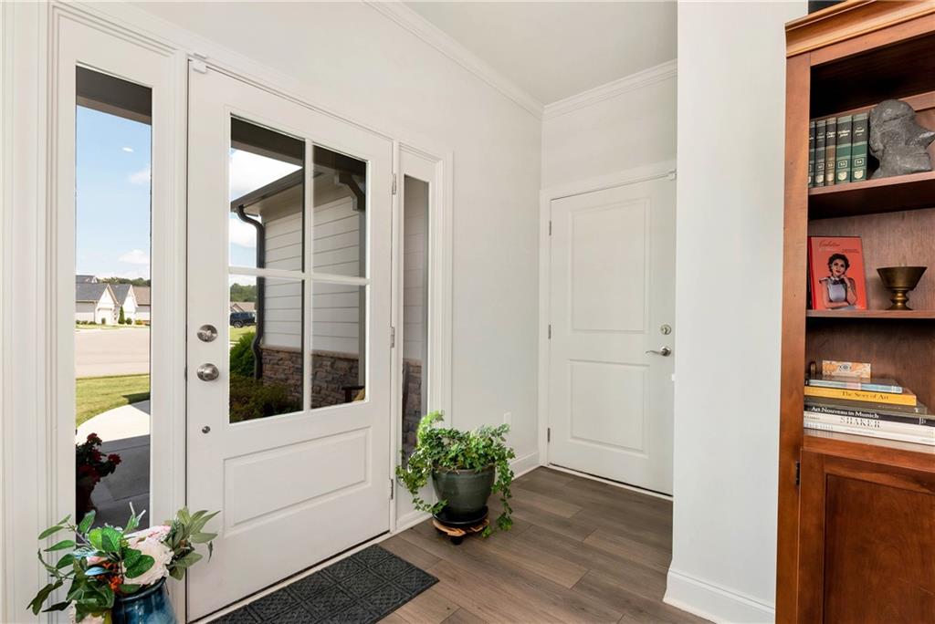 269 Grand Circle Jasper, GA 30143 - Photo 3 of 54 a view of a hallway with wooden floor and a potted plant
