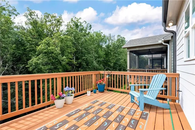 a view of balcony with deck and wooden floor