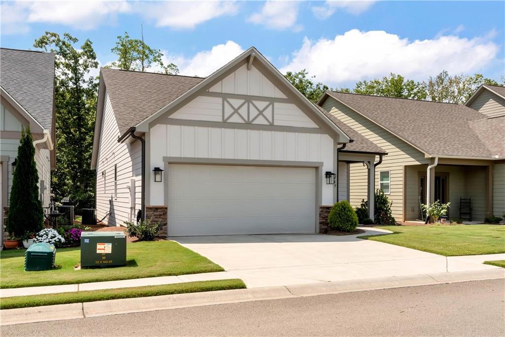 269 Grand Circle Jasper, GA 30143 - Photo 53 of 54 a front view of a house with a yard and garage
