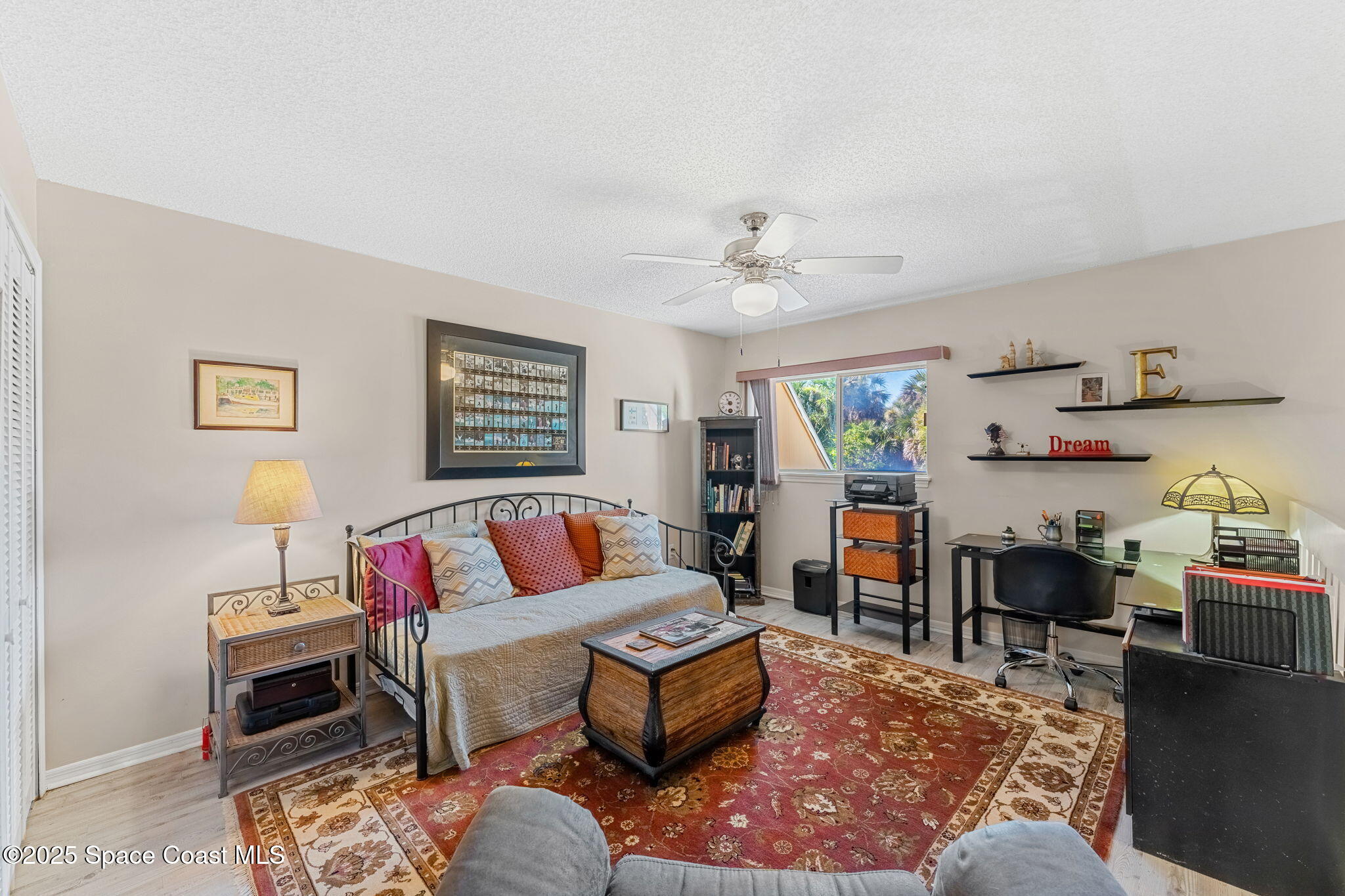 6205 Treetop Drive Melbourne Beach, FL 32951 - Photo 18 of 36 a living room with furniture and a wooden floor