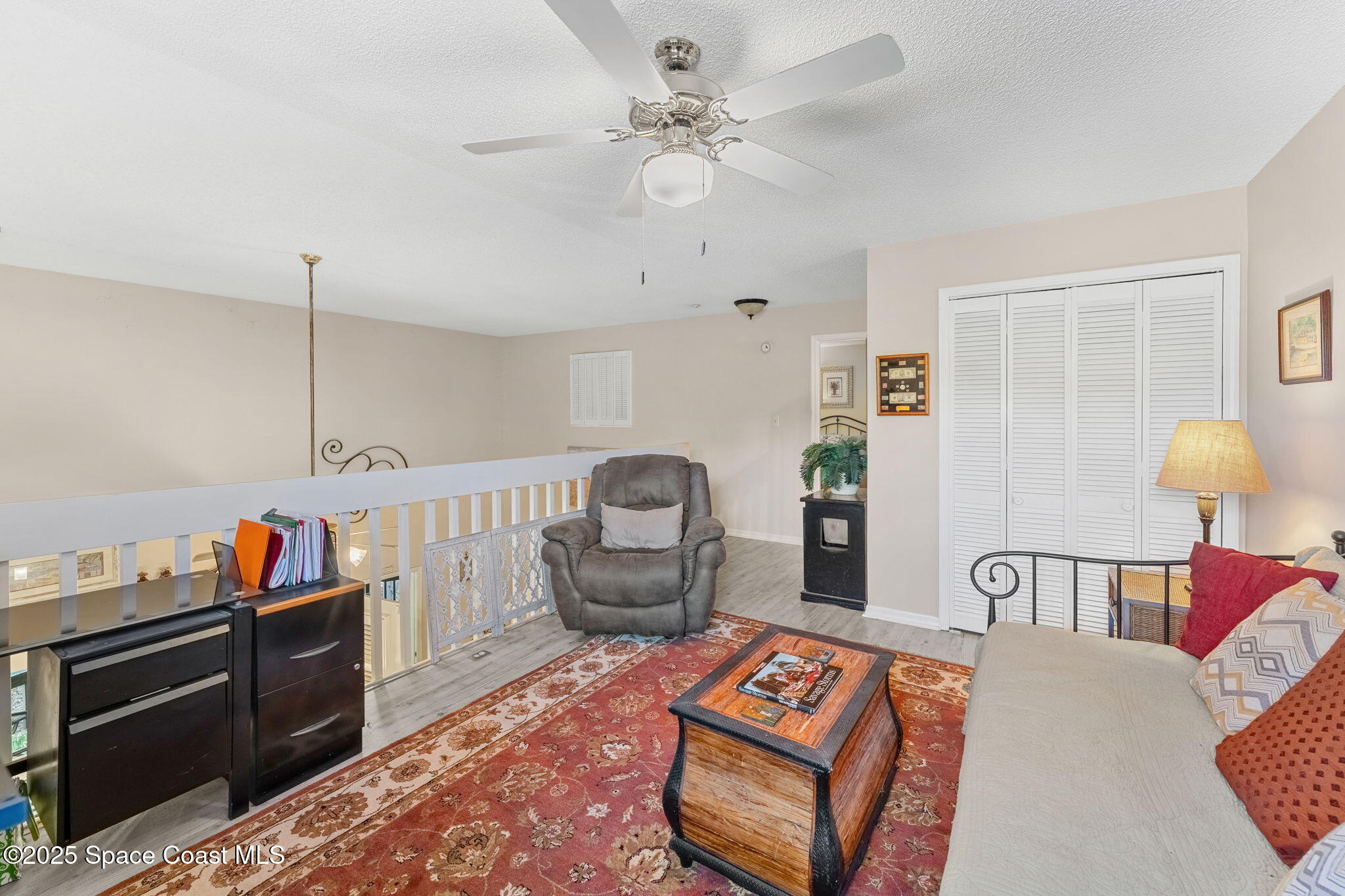 6205 Treetop Drive Melbourne Beach, FL 32951 - Photo 19 of 36 a bedroom with furniture and a baby crib