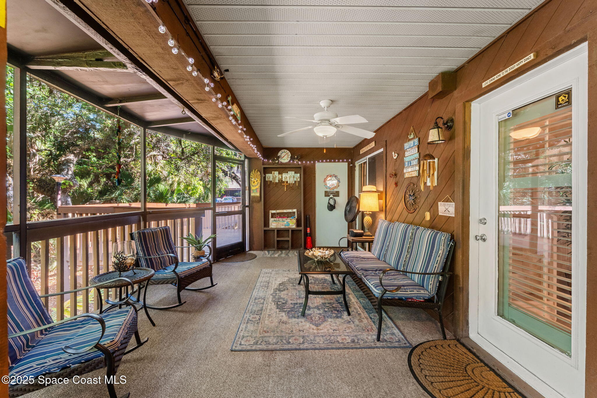 6205 Treetop Drive Melbourne Beach, FL 32951 - Photo 20 of 36 a view of a porch with furniture