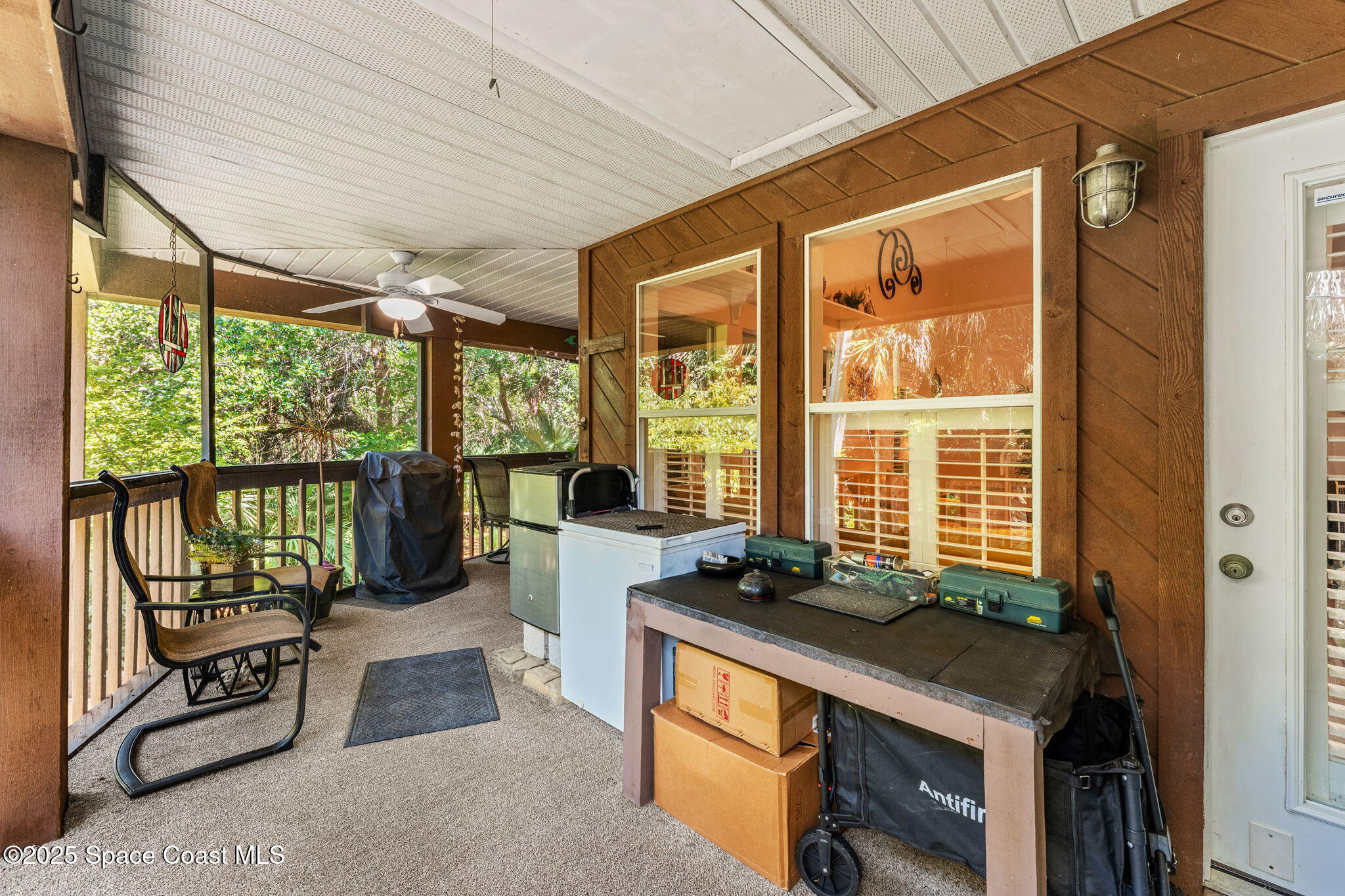 6205 Treetop Drive Melbourne Beach, FL 32951 - Photo 24 of 36 a view of room with balcony and furniture